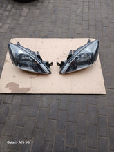Load image into Gallery viewer, Frontscheinwerfer Mitsubishi Lancer VII I Ein Satz Scheinwerfer Headlight SCH7761310468ga