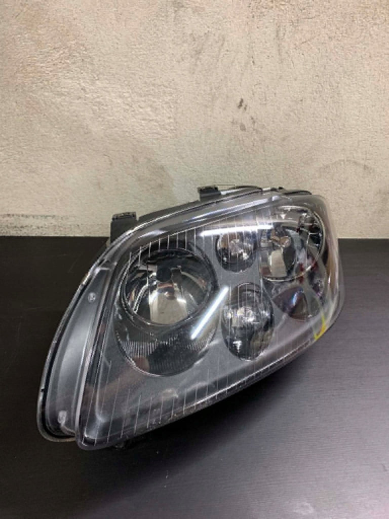 Frontscheinwerfer VW Touran Caddy I Links Scheinwerfer Headlight SCH6380839814bg