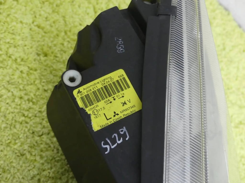 Frontscheinwerfer Mitsubishi Colt MR957345 Links Scheinwerfer Headlight