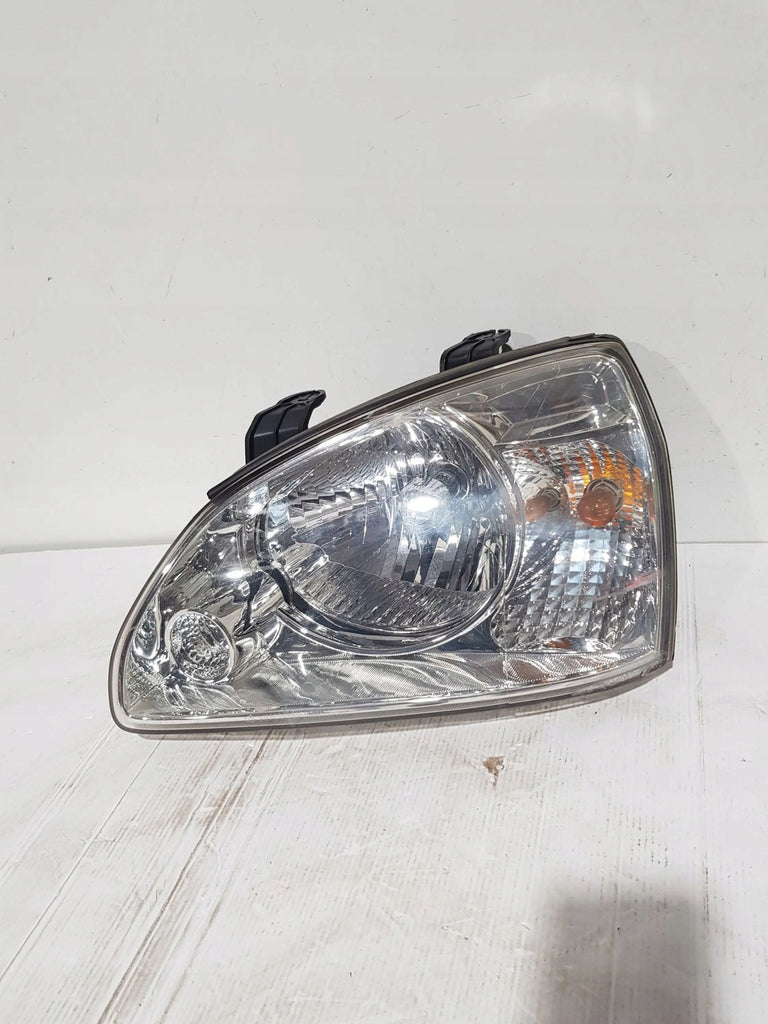 Frontscheinwerfer Kia Carens I Links Scheinwerfer Headlight