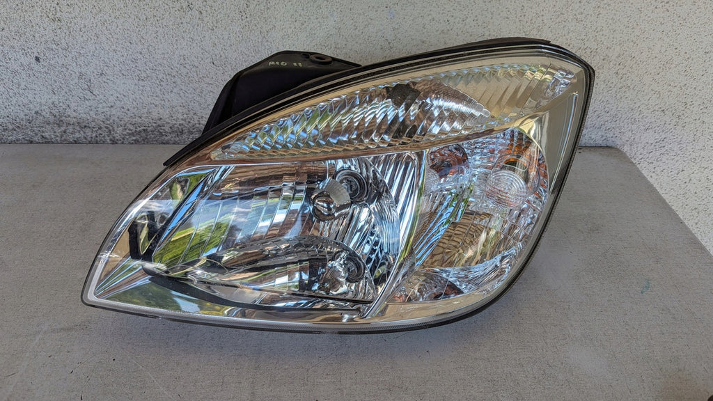 Frontscheinwerfer Kia Rio II Links Scheinwerfer Headlight