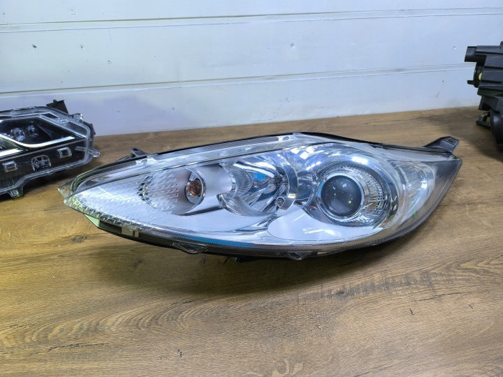 Frontscheinwerfer Ford Fiesta I H1BB-009 Links Scheinwerfer Headlight SCH4282346983xx