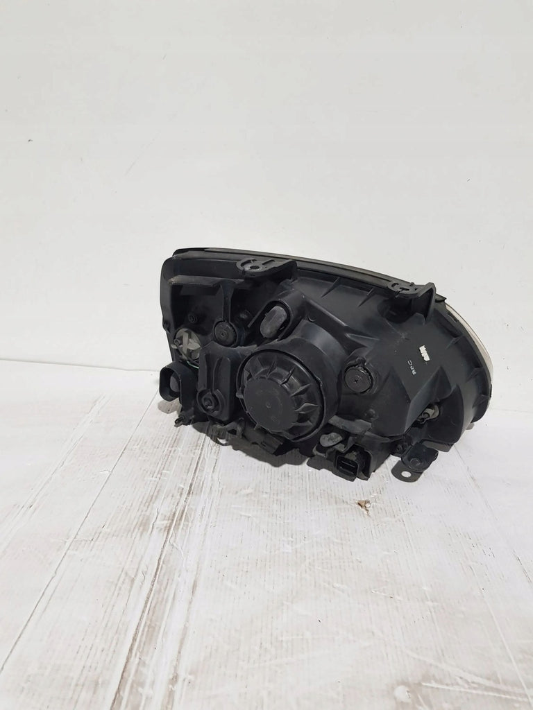 Frontscheinwerfer Kia Carens I Links Scheinwerfer Headlight