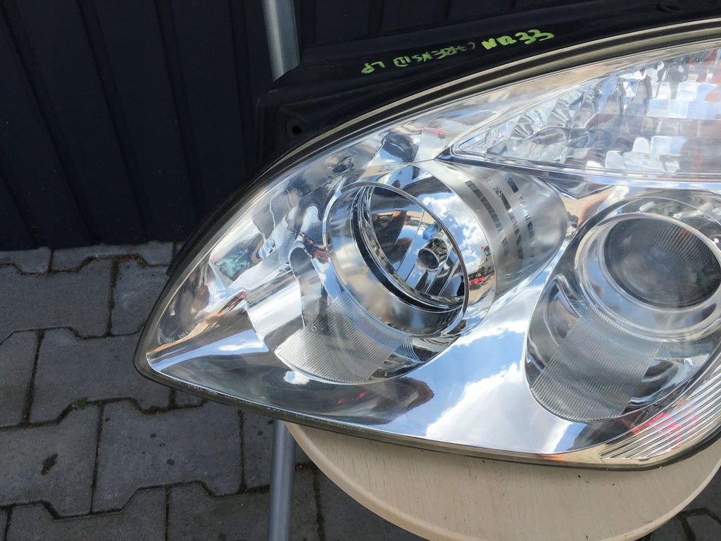 Frontscheinwerfer Kia Carens III Links Scheinwerfer Headlight